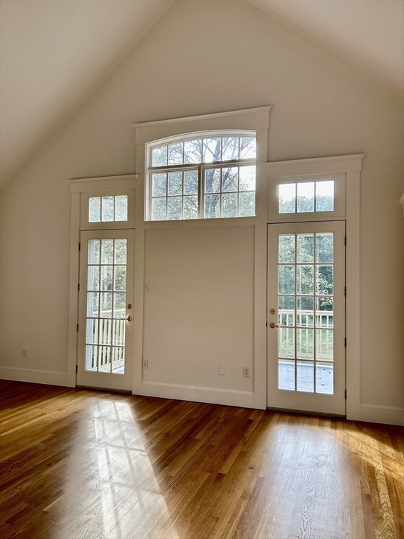 99 Tower Road Lincoln, MA 01773 - Photo 25 of 42 an empty room with wooden floor and windows