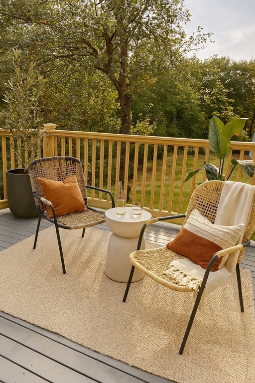 99 Tower Road Lincoln, MA 01773 - Photo 31 of 42 a view of a chairs and table on the terrace