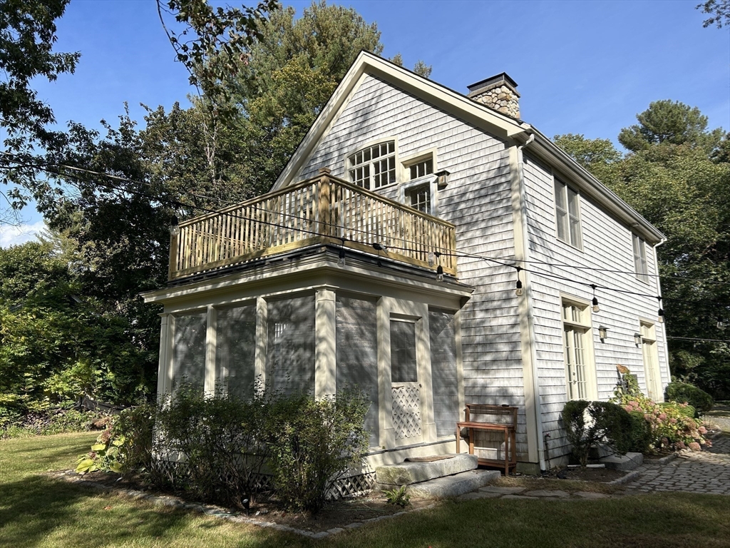 99 Tower Road Lincoln, MA 01773 - Photo 41 of 42 a view of a house with a yard