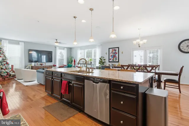 a living room with furniture window and a flat screen tv