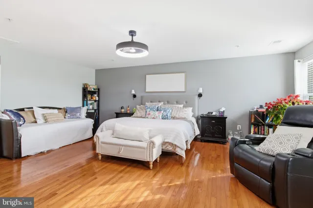 a bedroom with a bed and a couch