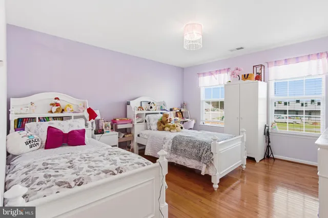 a bedroom that has a bed and a table in it