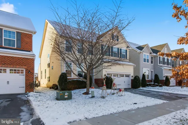a kitchen with granite countertop stainless steel appliances and wooden cabinets