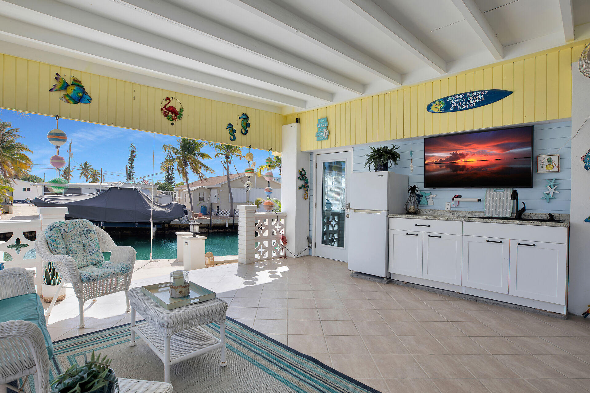 779 26th Street Ocean Marathon, FL 33050 - Photo 21 of 42 a living room with furniture and a flat screen tv
