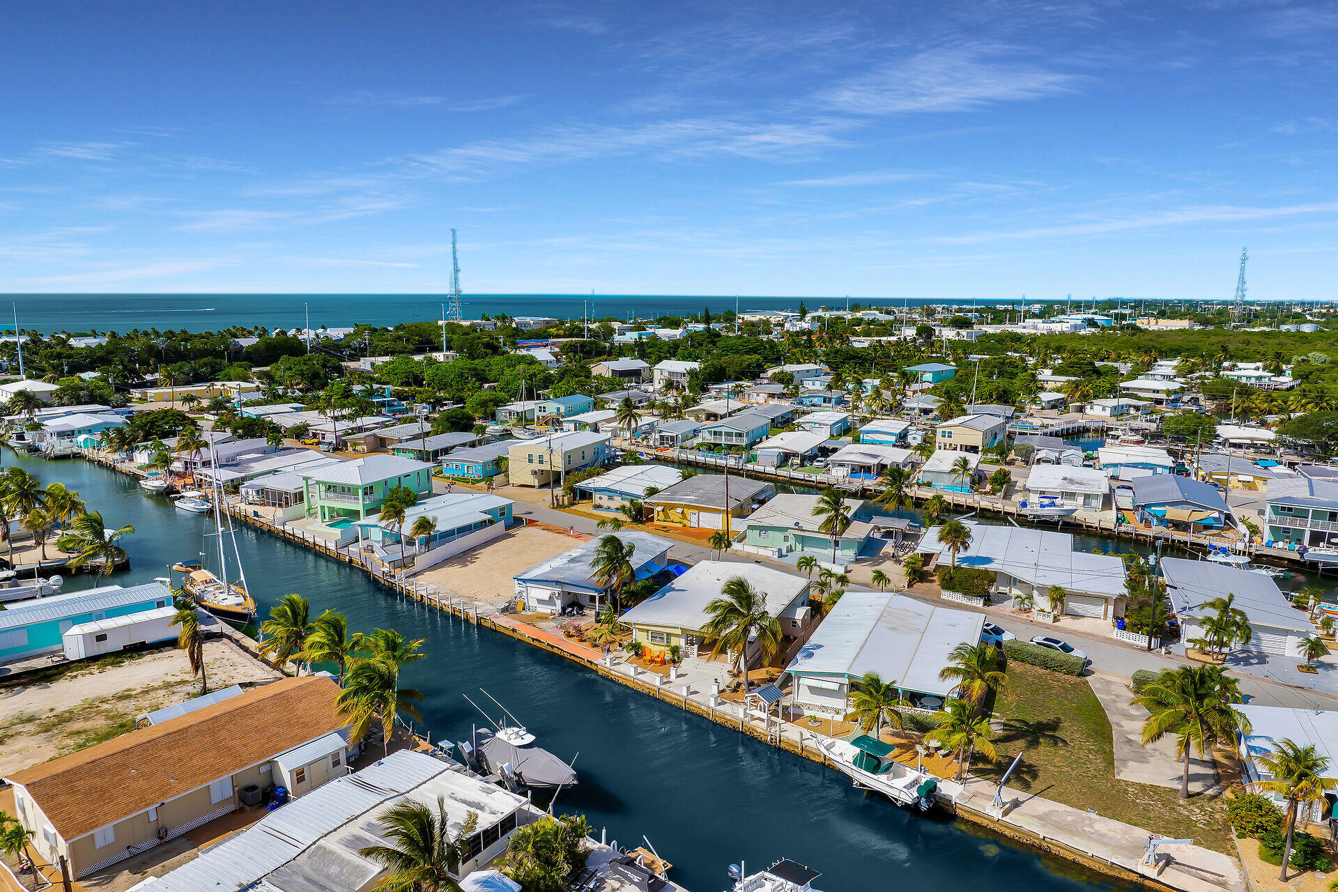 779 26th Street Ocean Marathon, FL 33050 - Photo 34 of 42 an aerial view of a city with lots of residential buildings and ocean view in back