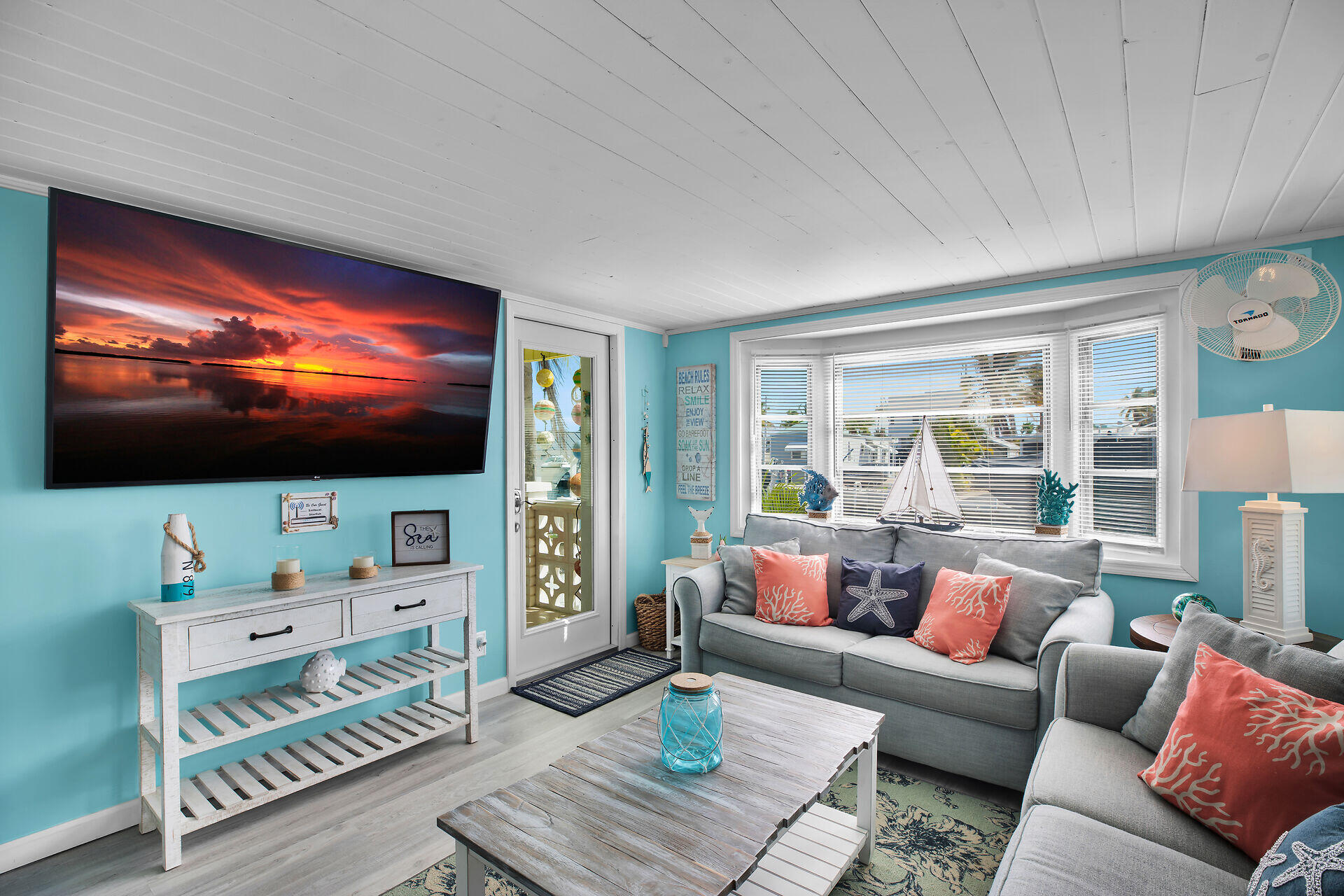 779 26th Street Ocean Marathon, FL 33050 - Photo 4 of 42 a living room with furniture and a flat screen tv