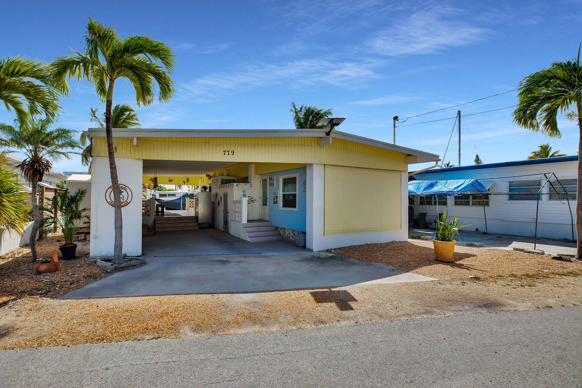 779 26th Street Ocean Marathon, FL 33050 - Photo 41 of 42 a view of a house with outdoor space and palm trees