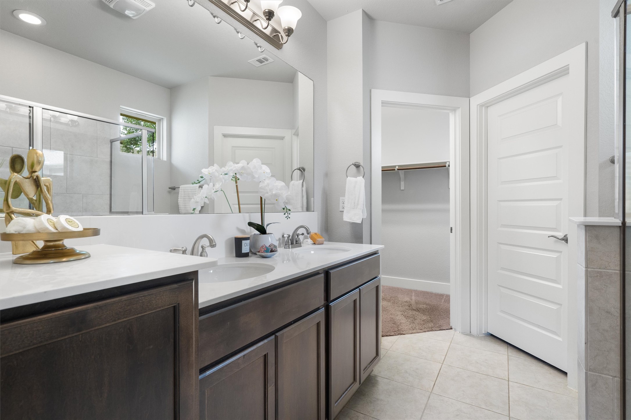 10625 Wills Loop Austin, TX 78717 - Photo 17 of 38 The ensuite primary bathroom is bright with an abundance of light.