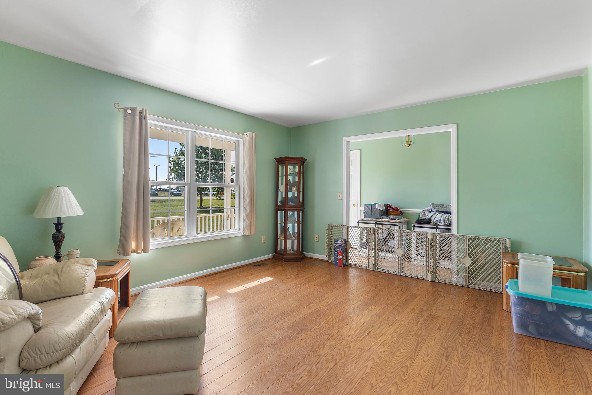 7112 East New Market Ellwood Road Hurlock, MD 21643 - Photo 4 of 41 a living room with furniture and a window