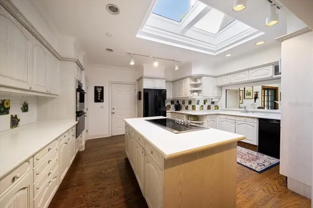 a bed room with a bed and a chair