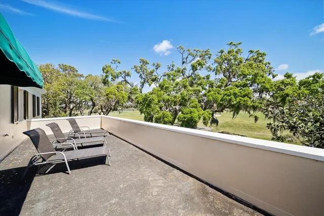 a spacious bedroom with two large bed and a chandelier