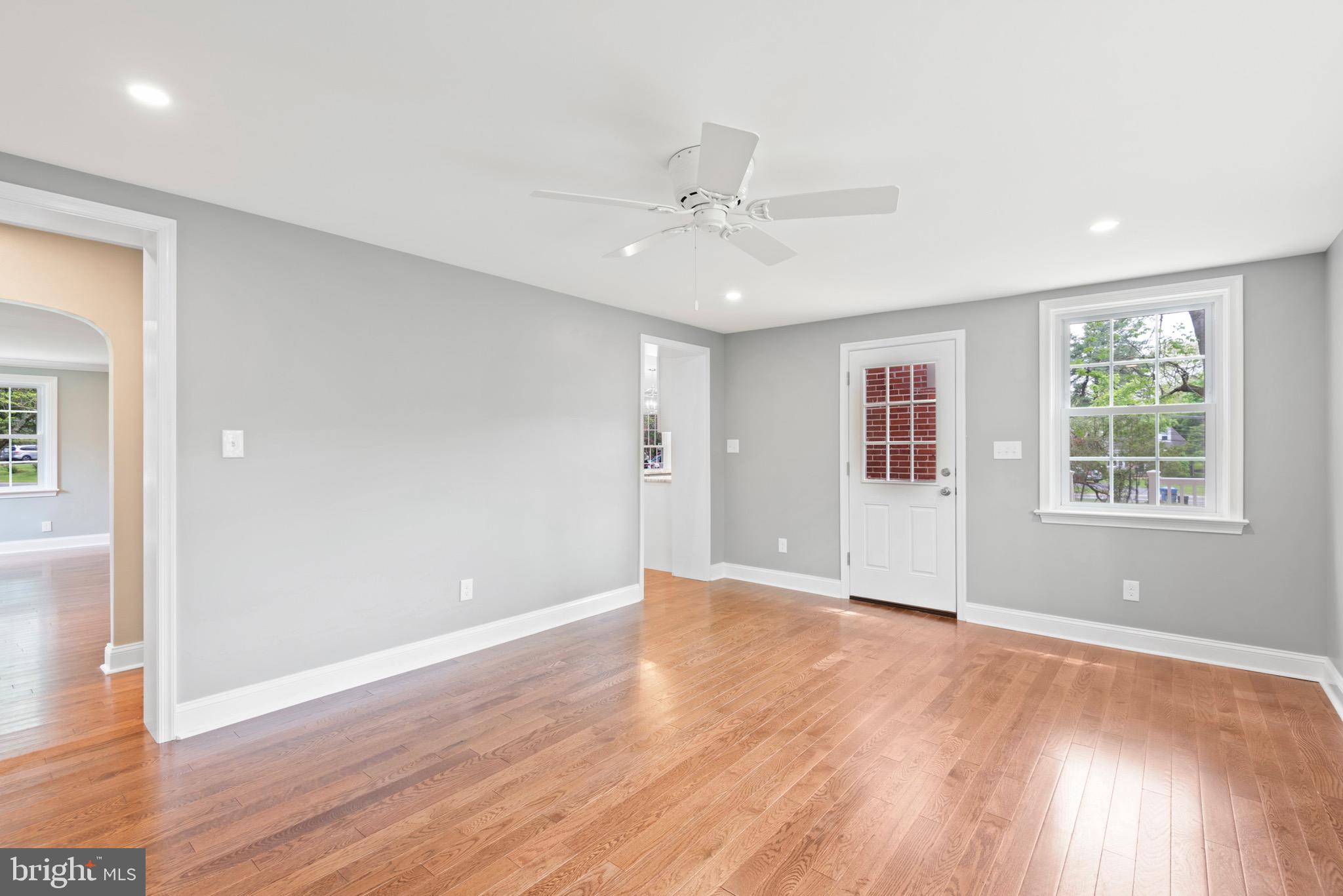 103 East Rose Valley Road Wallingford, PA 19086 - Photo 14 of 75 a view of an empty room with wooden floor and a window