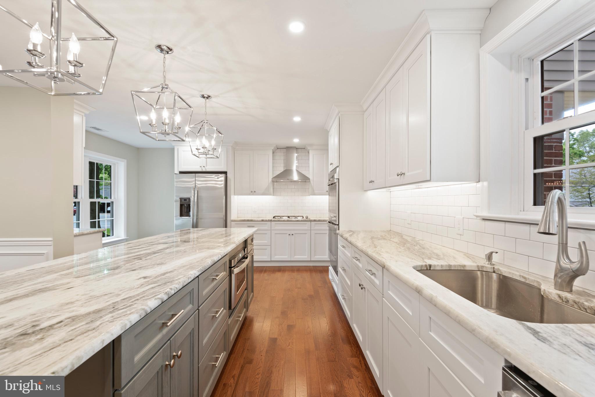 103 East Rose Valley Road Wallingford, PA 19086 - Photo 28 of 75 a large kitchen with granite countertop a large counter top and cabinets