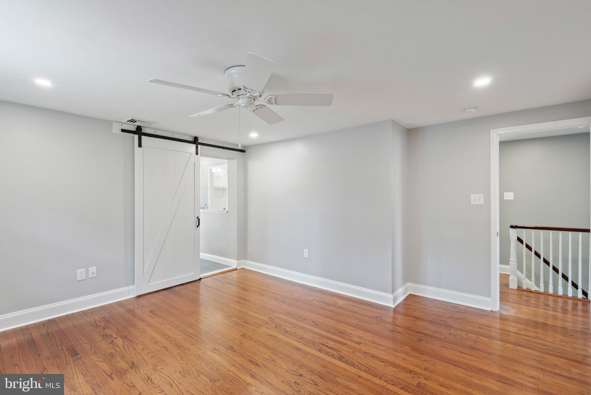 103 East Rose Valley Road Wallingford, PA 19086 - Photo 36 of 75 a view of an empty room with wooden floor