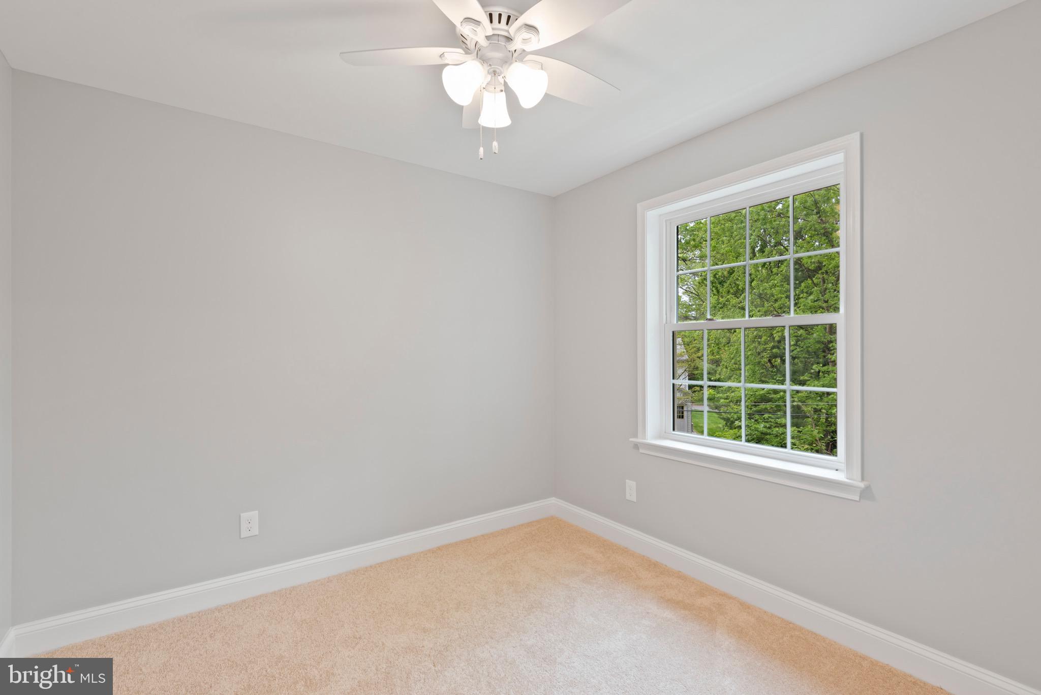 103 East Rose Valley Road Wallingford, PA 19086 - Photo 46 of 75 an empty room with a window and a fan
