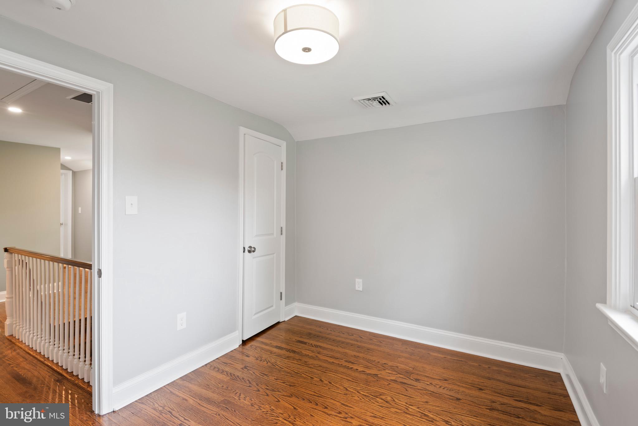 103 East Rose Valley Road Wallingford, PA 19086 - Photo 61 of 75 a view of an empty room with wooden floor