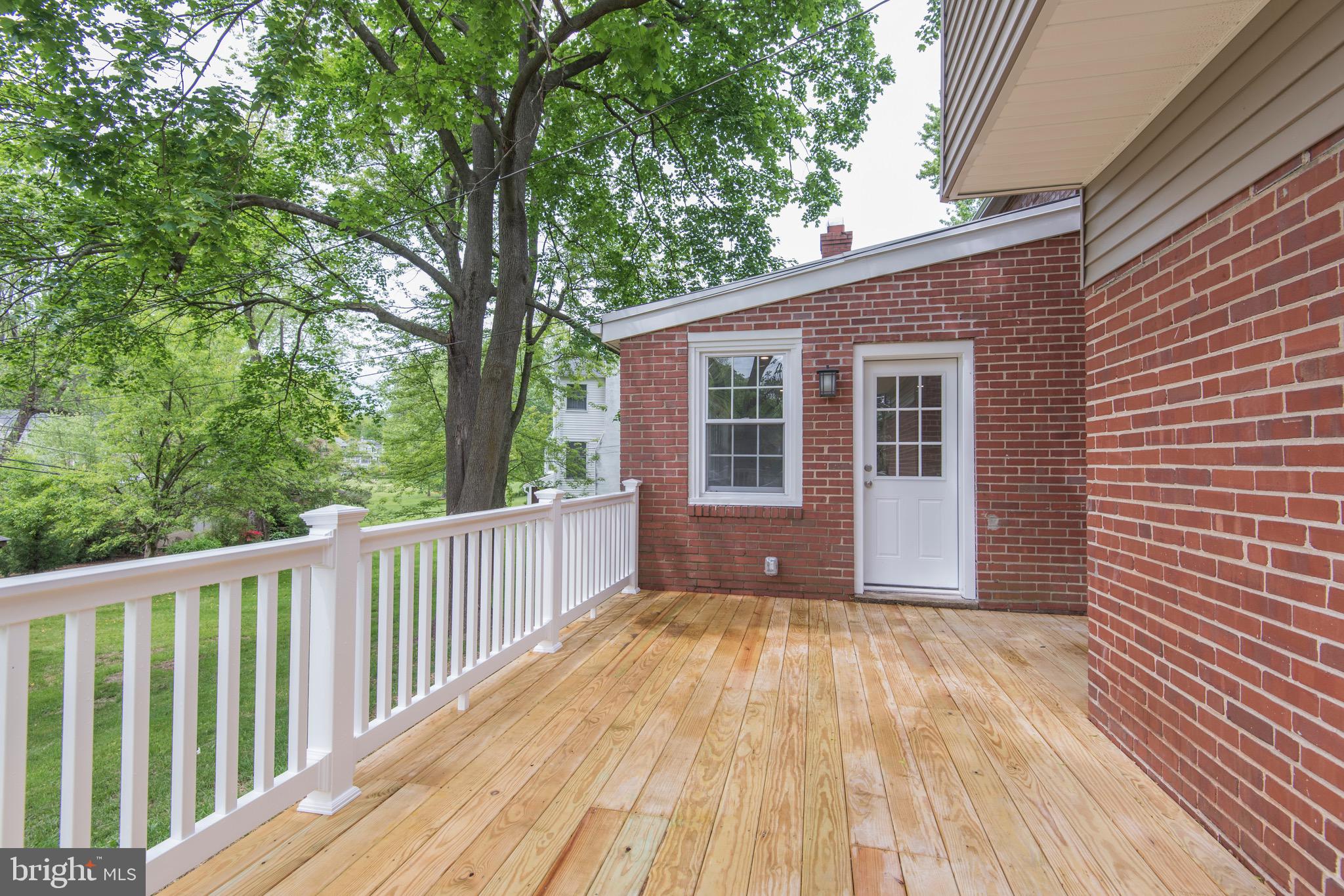 103 East Rose Valley Road Wallingford, PA 19086 - Photo 67 of 75 a view of backyard with deck and wooden floor
