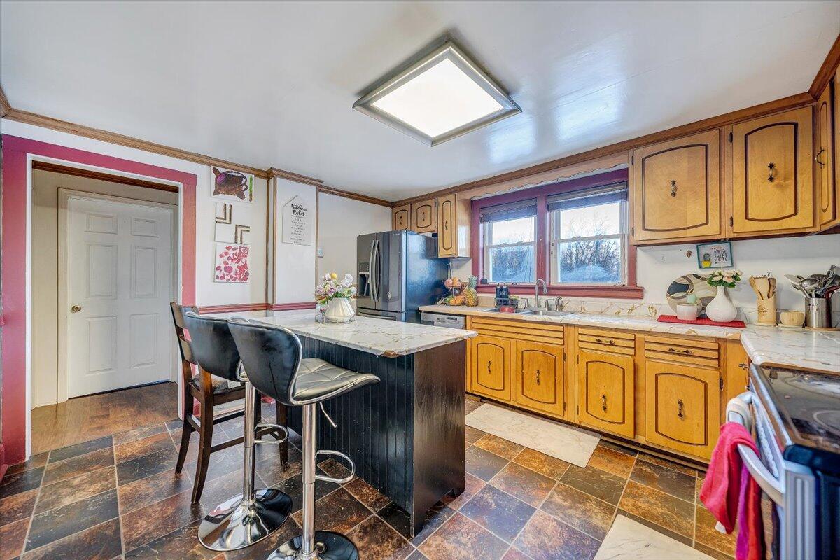 2412 Quarterwood Road Montvale, VA 24122 - Photo 8 of 48 a kitchen with stainless steel appliances granite countertop a stove a sink dishwasher and cabinets with wooden floor