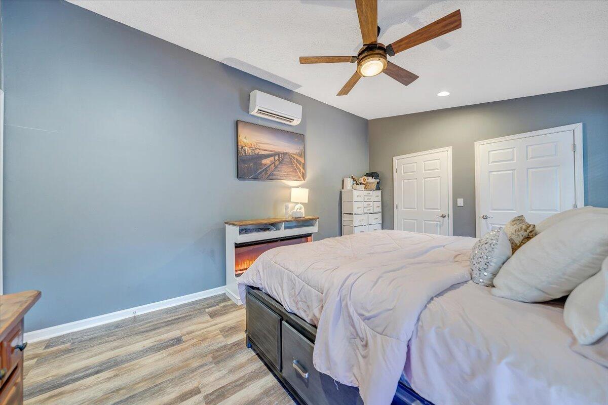 2412 Quarterwood Road Montvale, VA 24122 - Photo 15 of 48 a bedroom with a bed and a chandelier