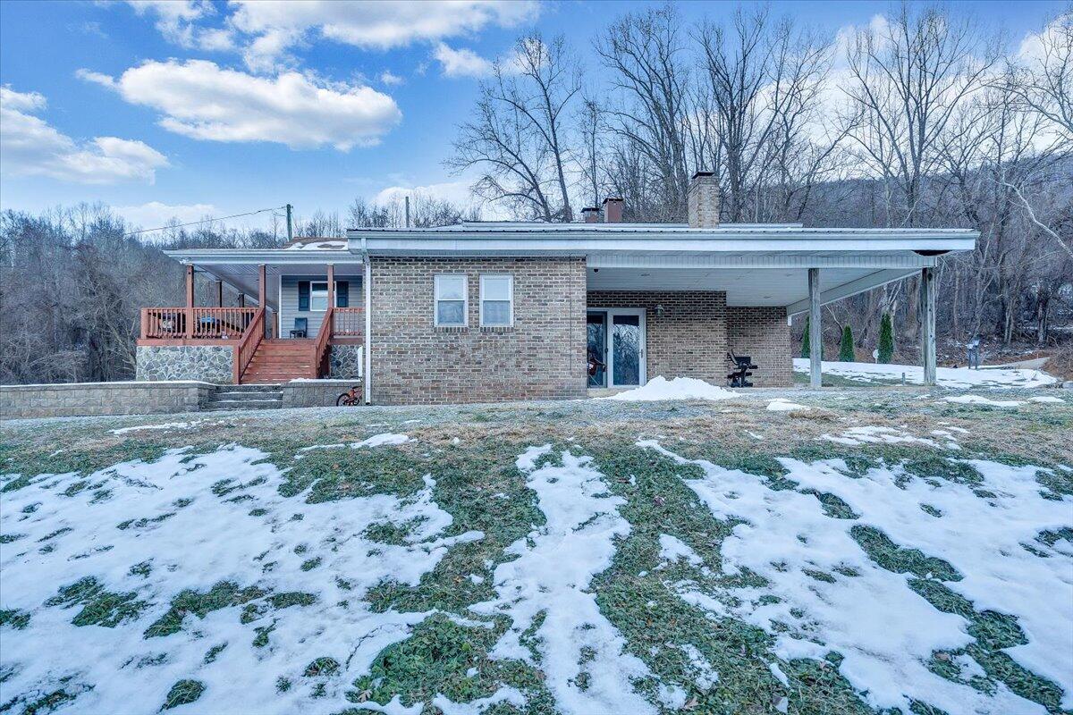 2412 Quarterwood Road Montvale, VA 24122 - Photo 36 of 48 a view of a white house with large trees and outdoor space