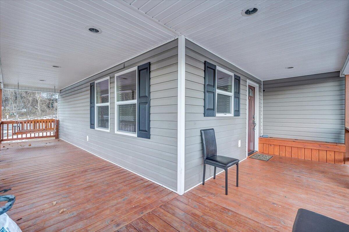 2412 Quarterwood Road Montvale, VA 24122 - Photo 2 of 48 a view of an entryway with wooden floor and fence