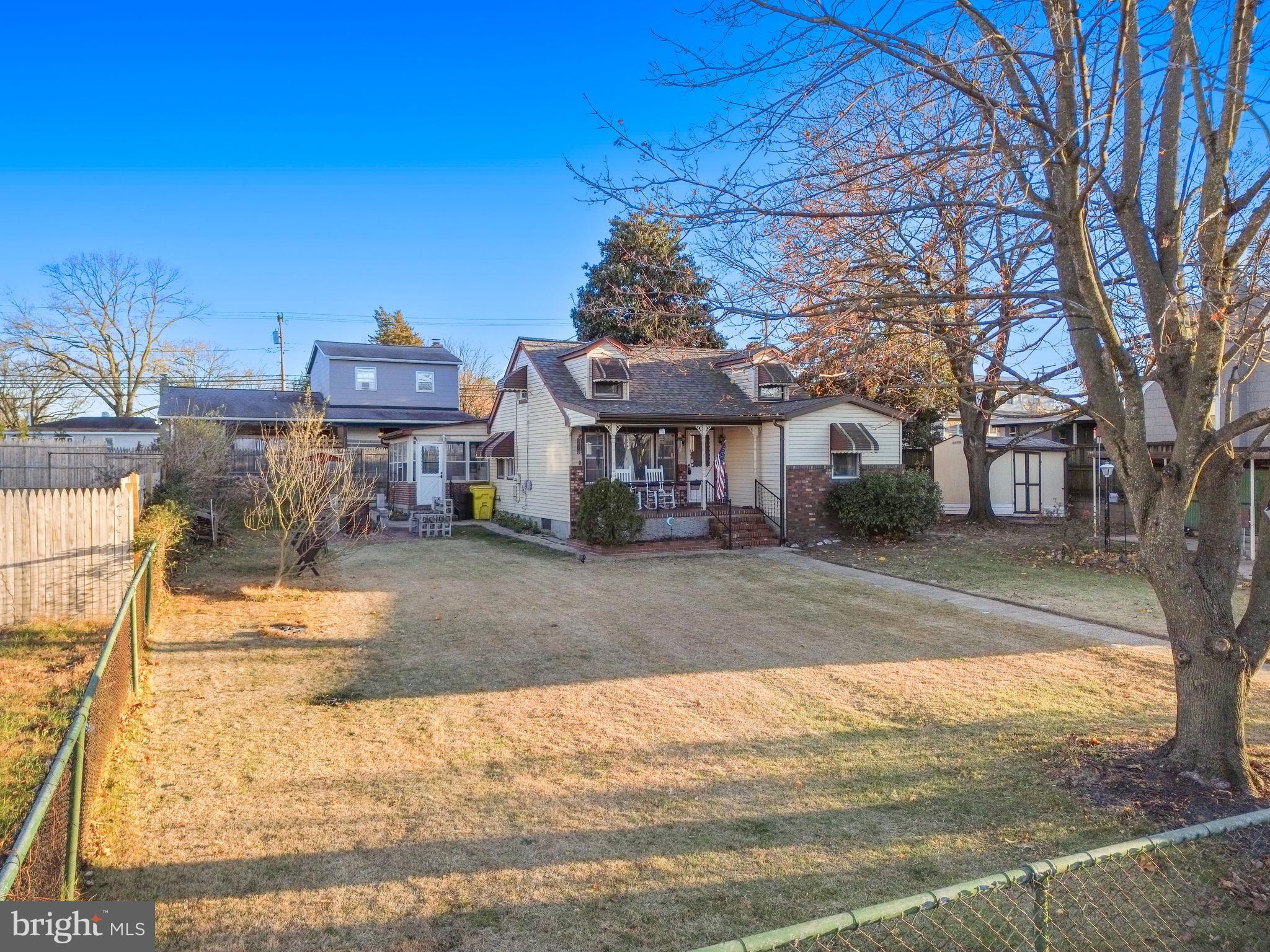 102 Queen Anne Road Glen Burnie, MD 21060 - Photo 3 of 26 a view of a house with a yard