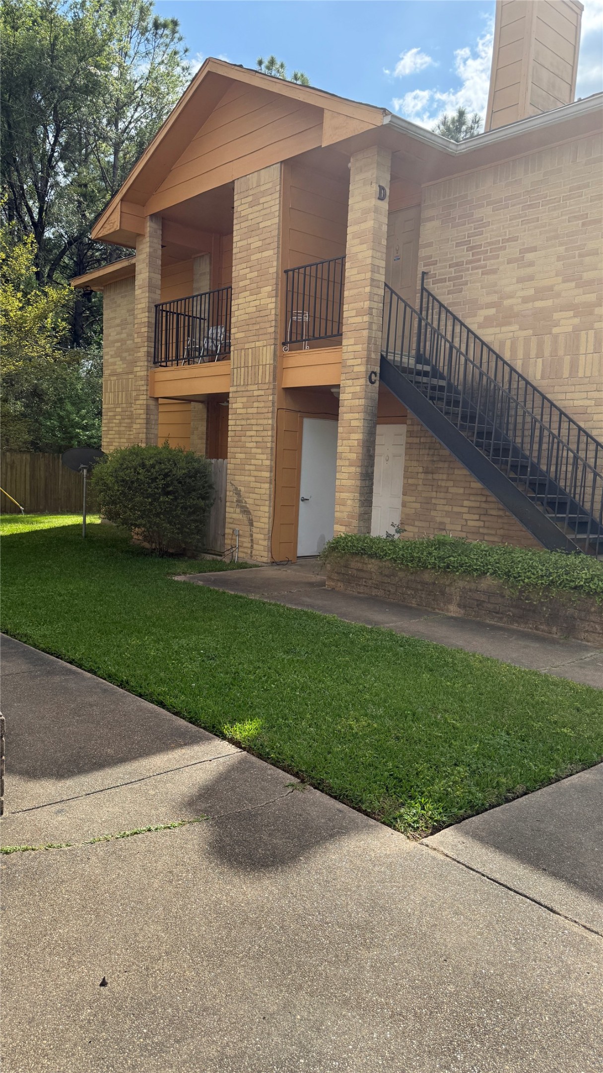 6307 West Gulf Bank Road, Unit 16 Houston, TX 77088 - Photo 9 of 9 a front view of a house with a yard
