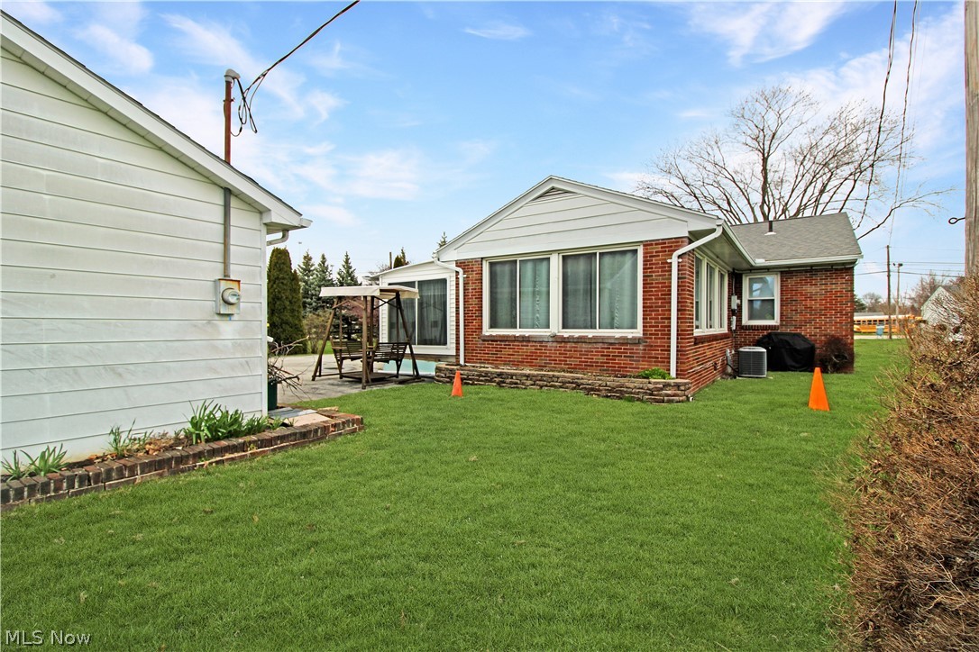 1036 West Fremont Road Port Clinton, OH 43452 - Photo 30 of 32 View of yard featuring a patio area
