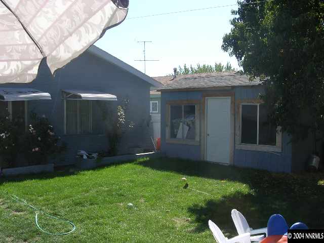 1555 Radcliffe Drive Reno, NV 89502 - Photo 2 of 2 a backyard of a house with lots of green space