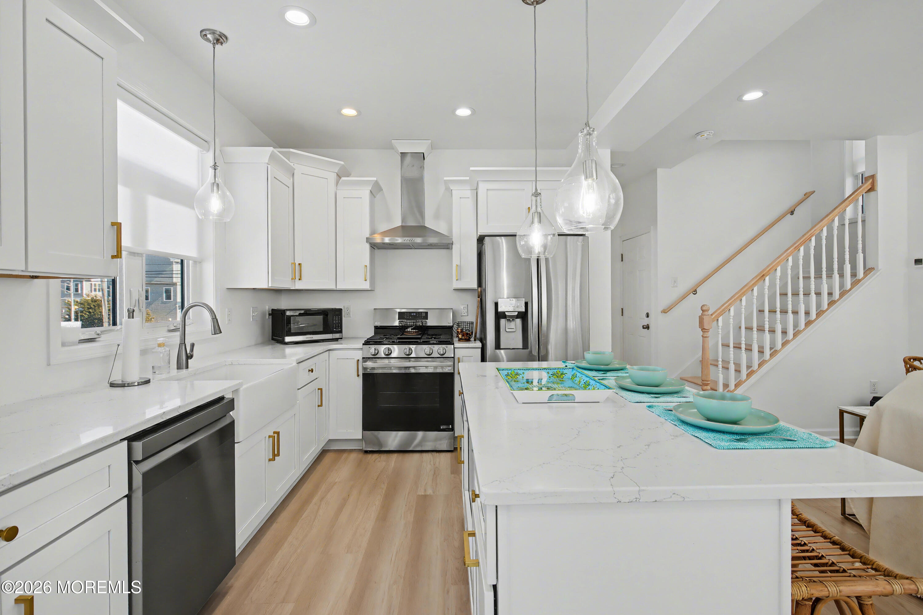 155 West Atlantic Way Lavallette, NJ 08735 - Photo 17 of 53 a kitchen with stainless steel appliances kitchen island granite countertop a sink a stove a refrigerator and island with wooden floor