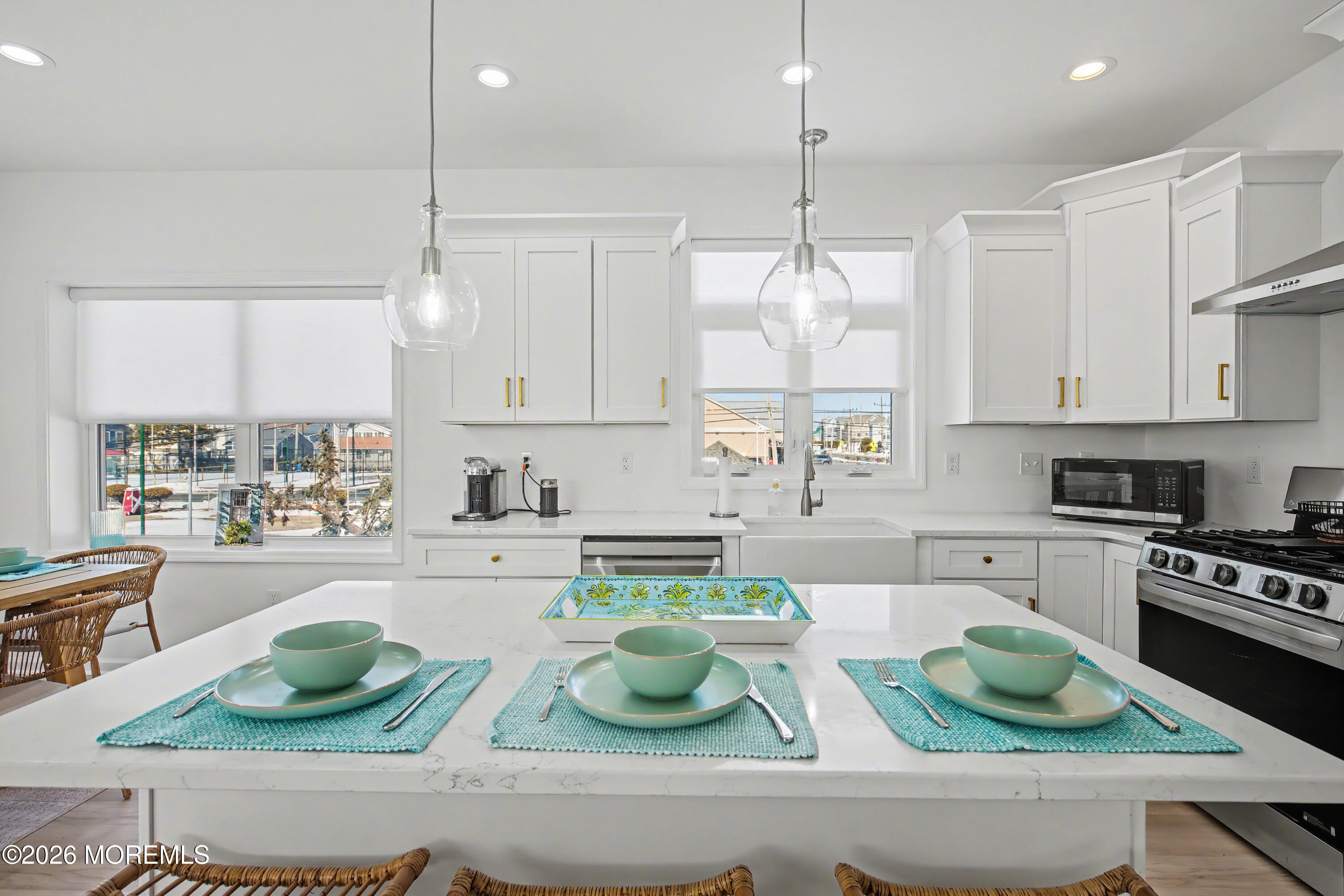 155 West Atlantic Way Lavallette, NJ 08735 - Photo 19 of 53 a kitchen with white cabinets and appliances