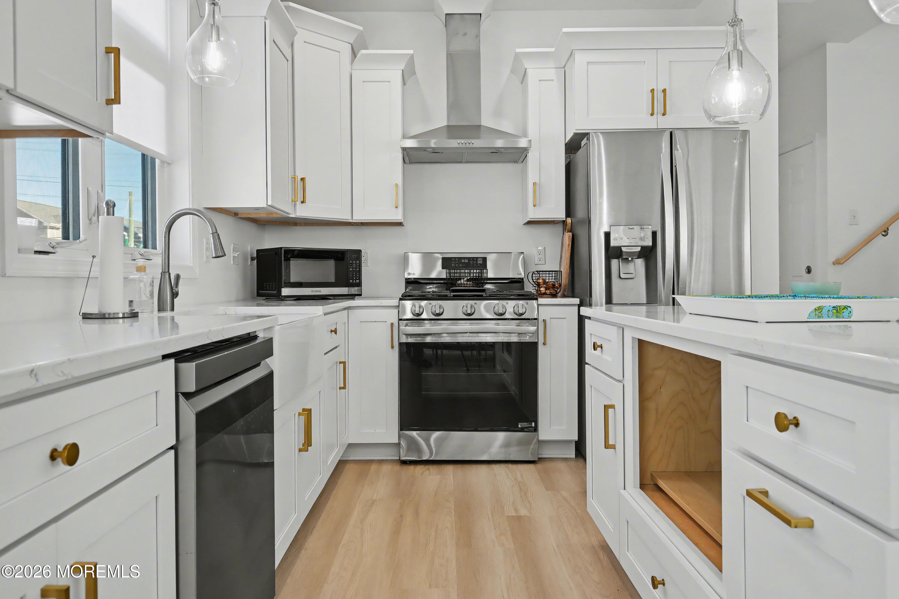 155 West Atlantic Way Lavallette, NJ 08735 - Photo 21 of 53 a kitchen with stainless steel appliances white cabinets and a stove
