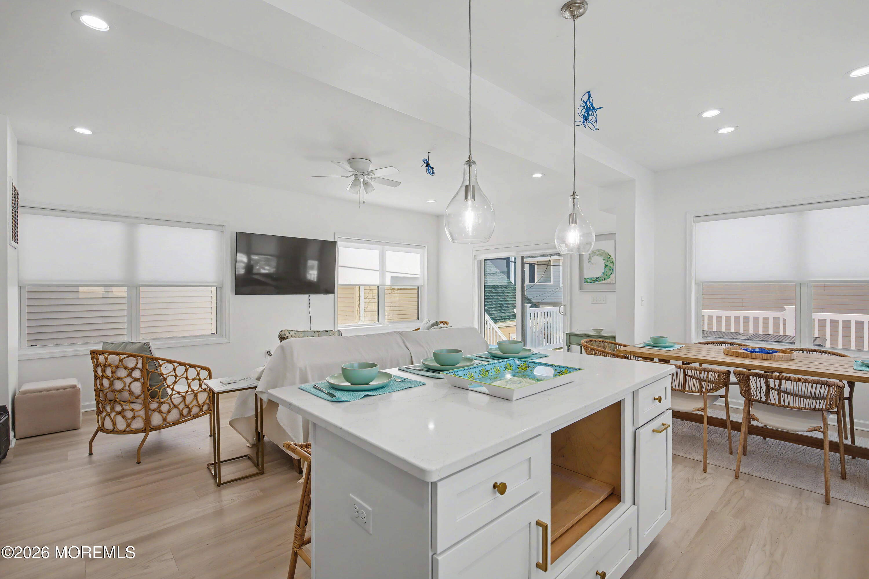 155 West Atlantic Way Lavallette, NJ 08735 - Photo 22 of 53 a open kitchen with stainless steel appliances kitchen island granite countertop a stove a sink a dining table and chairs with wooden floor