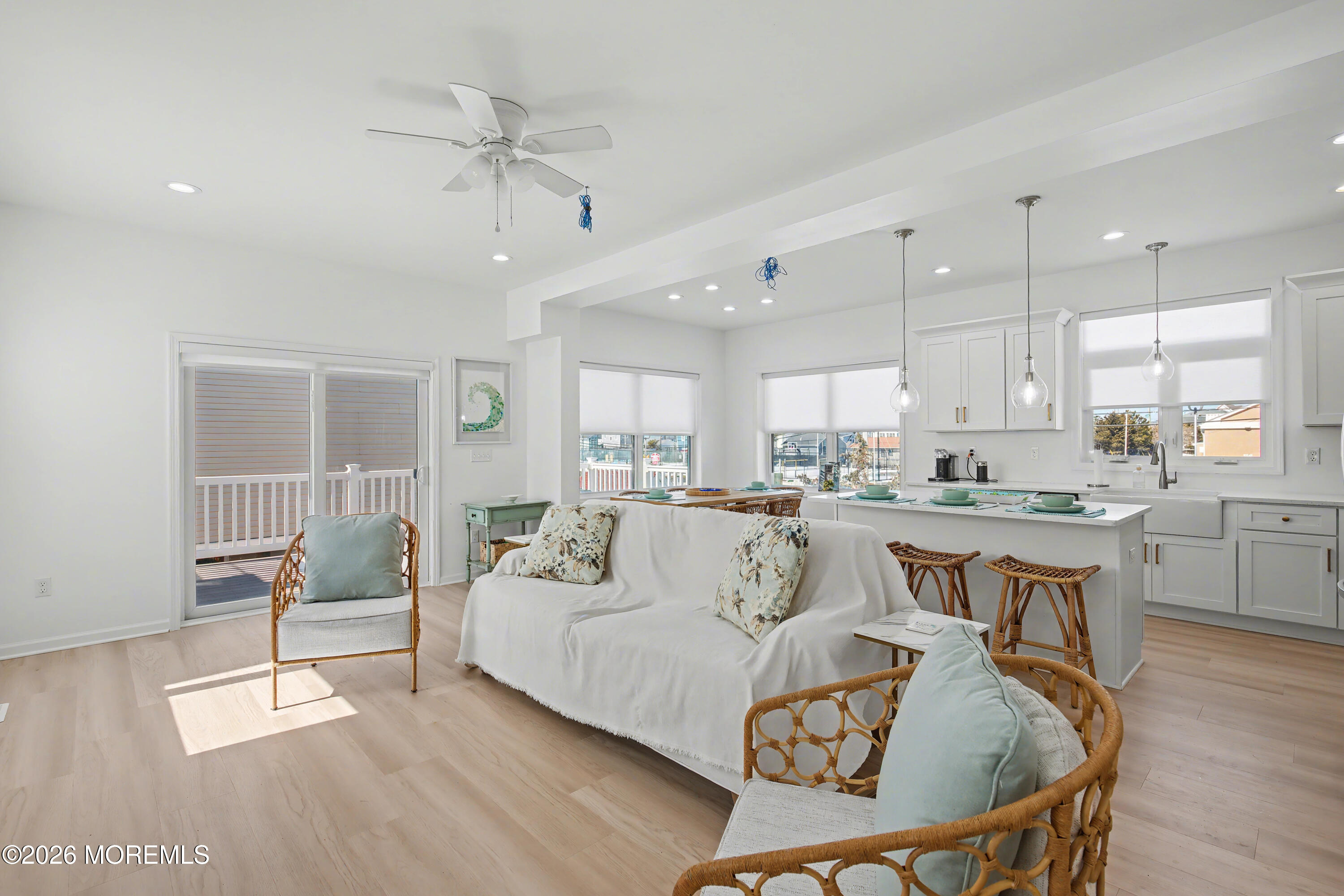 155 West Atlantic Way Lavallette, NJ 08735 - Photo 27 of 53 a living room with furniture a dining table and kitchen view