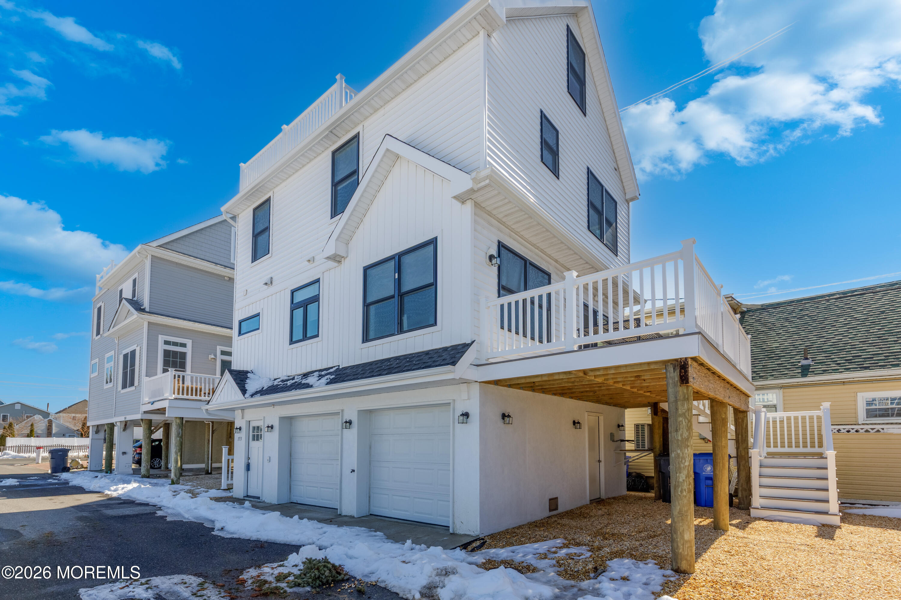 155 West Atlantic Way Lavallette, NJ 08735 - Photo 3 of 53 a view of a white building with many windows