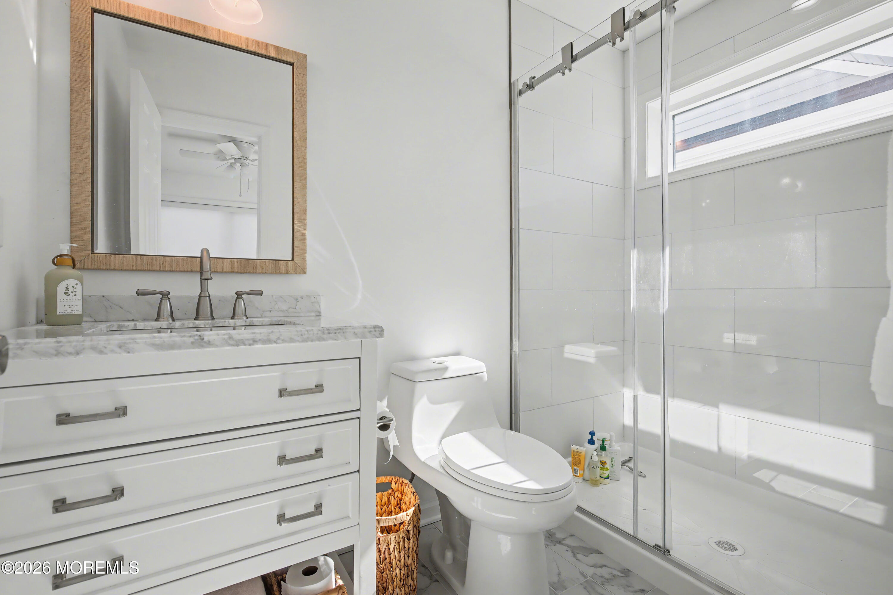 155 West Atlantic Way Lavallette, NJ 08735 - Photo 31 of 53 a bathroom with a granite countertop toilet sink and a mirror