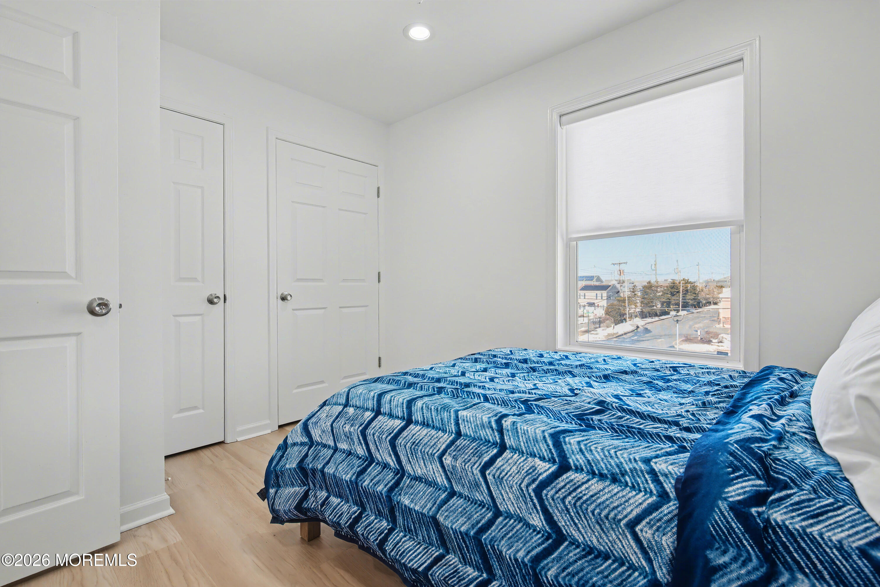 155 West Atlantic Way Lavallette, NJ 08735 - Photo 32 of 53 a bedroom with a bed and a window