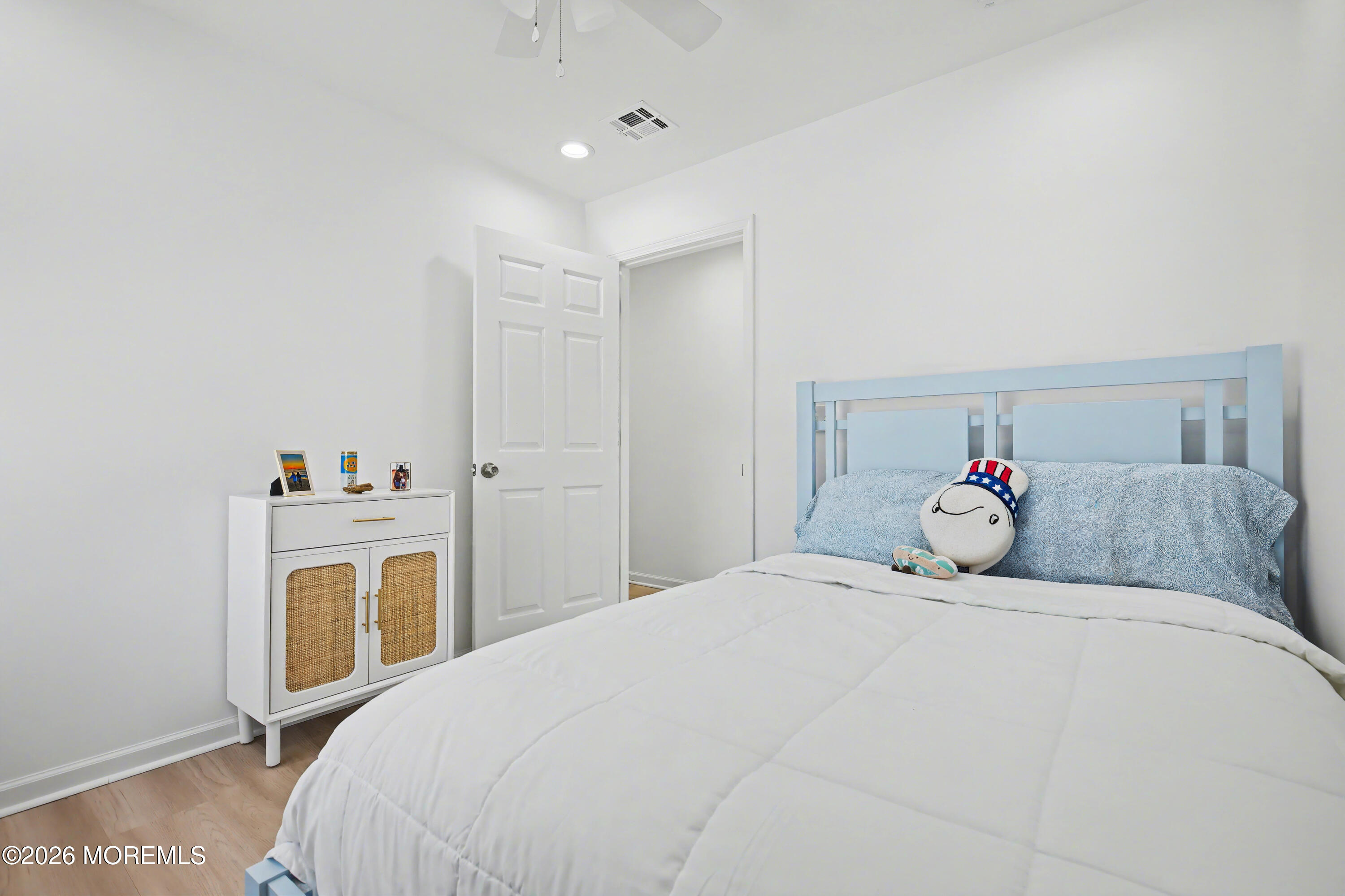 155 West Atlantic Way Lavallette, NJ 08735 - Photo 34 of 53 a bedroom with a bed and a table