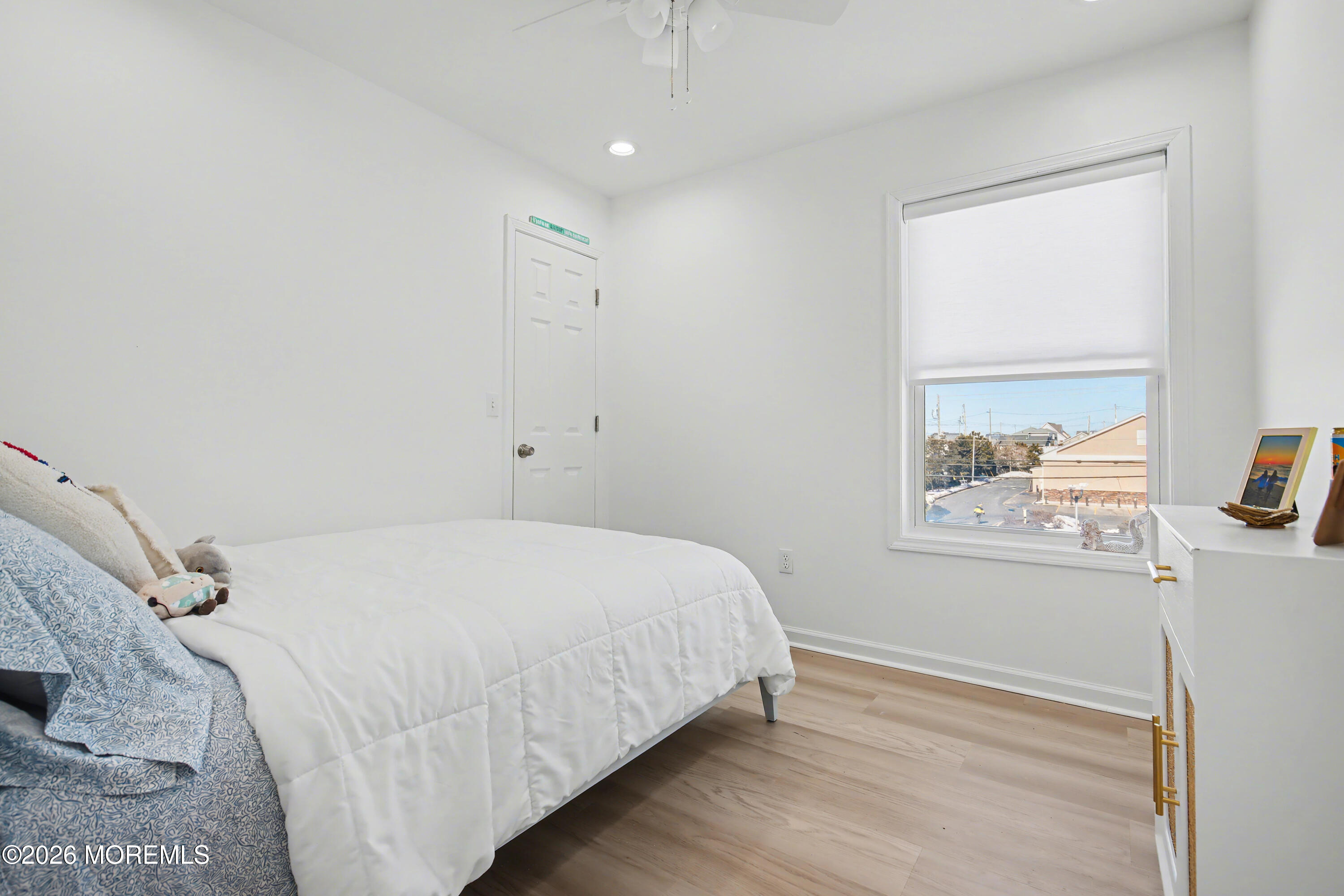 155 West Atlantic Way Lavallette, NJ 08735 - Photo 35 of 53 a bedroom with a bed and a window