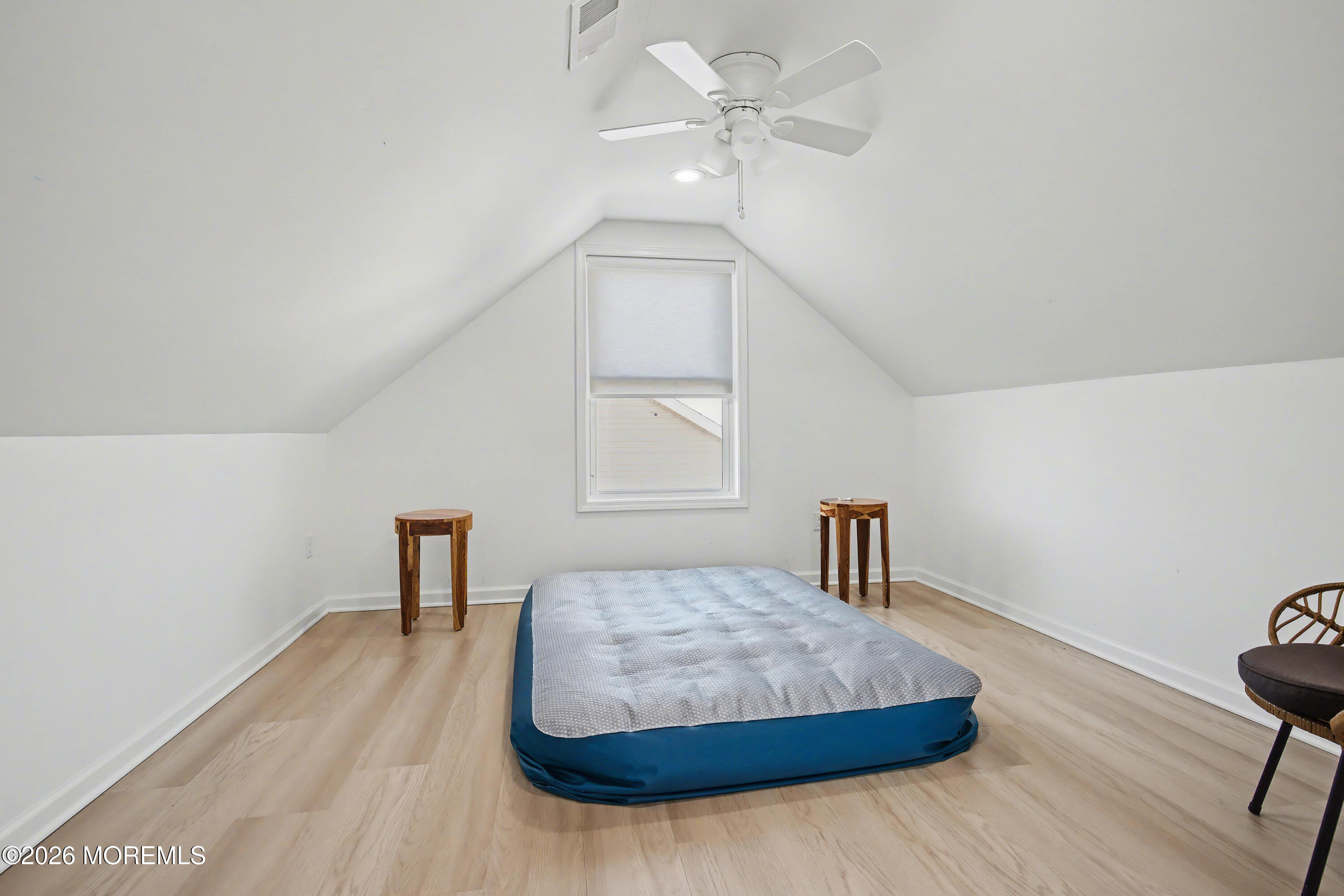 155 West Atlantic Way Lavallette, NJ 08735 - Photo 40 of 53 a bedroom with a bed and a table in it