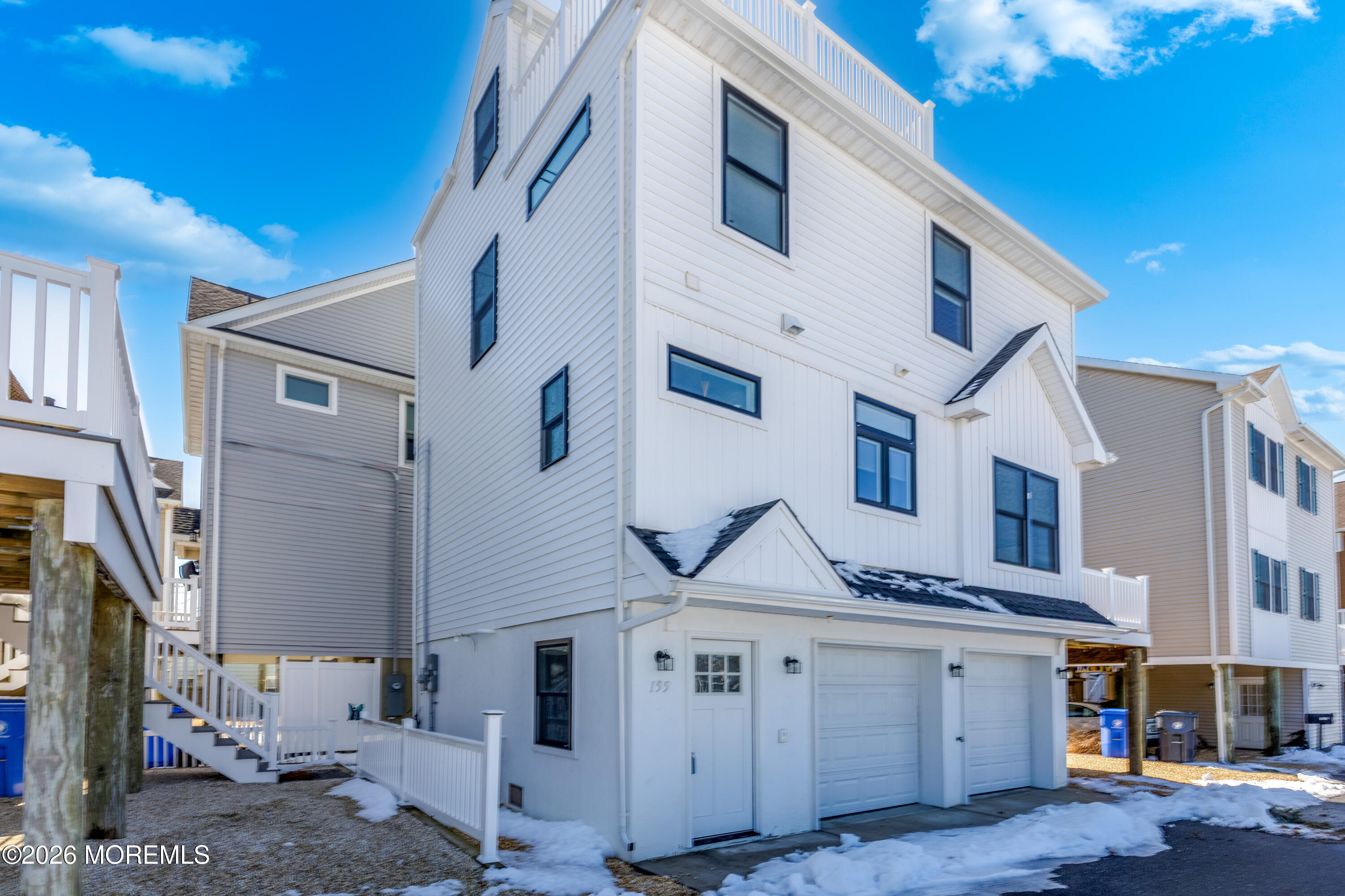 155 West Atlantic Way Lavallette, NJ 08735 - Photo 4 of 53 a view of a white building with many windows