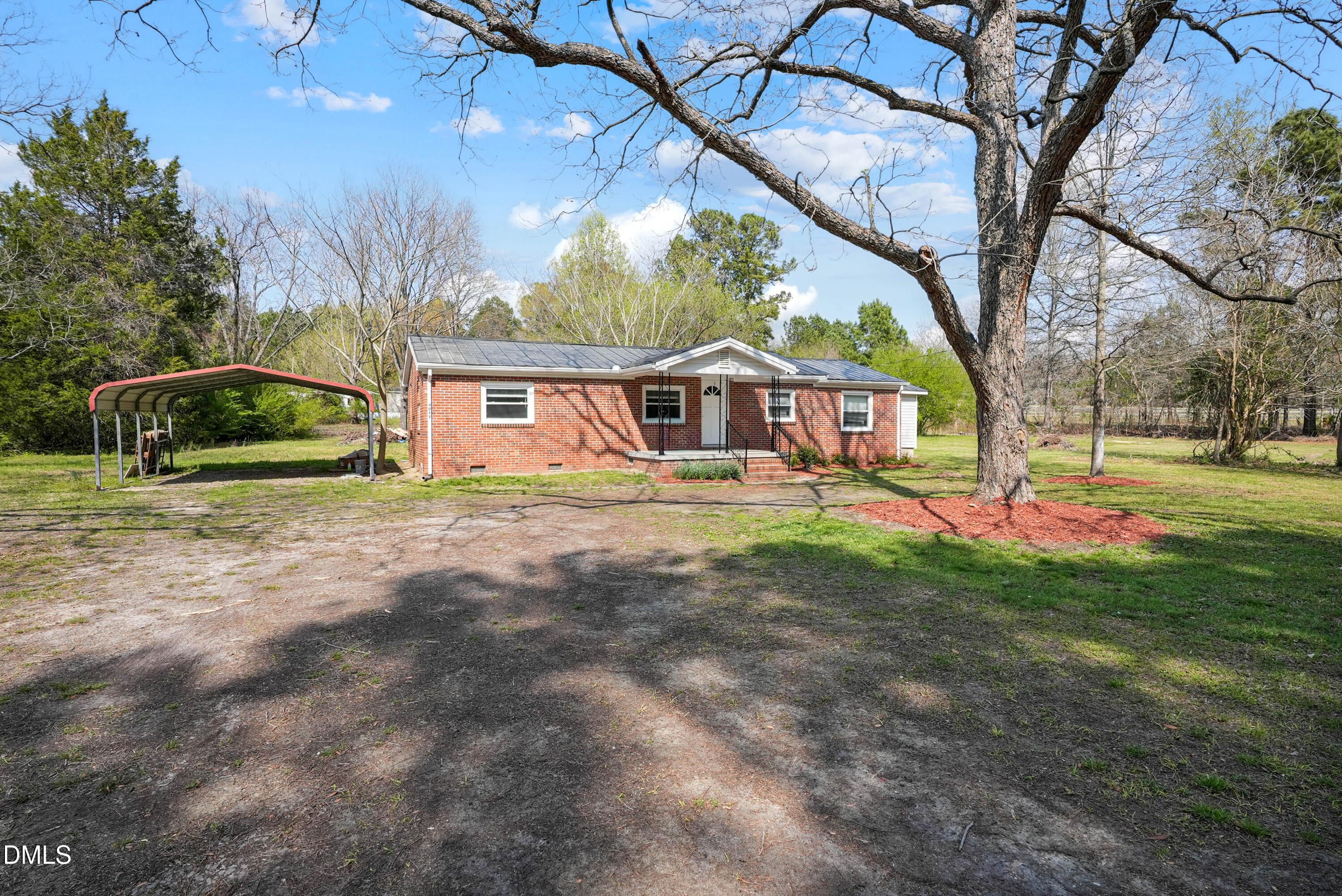 4077 Vass-Carthage Road Carthage, NC 28327 - Photo 4 of 23 a view of house with a yard and potted plants