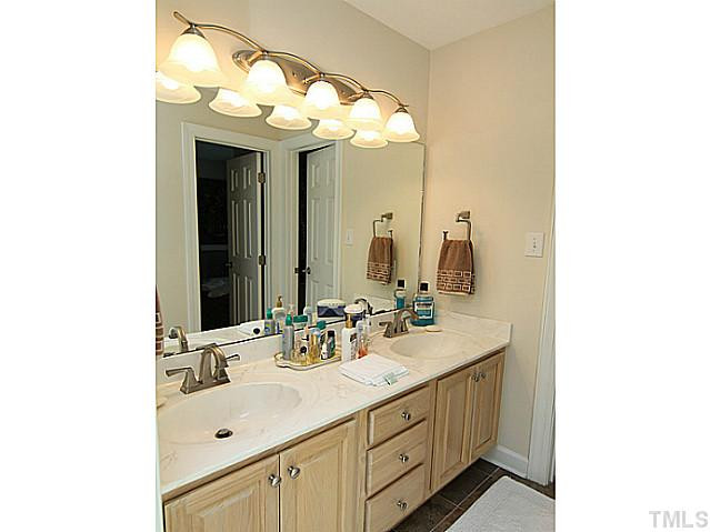 12025 Pembridge Lane Raleigh, NC 27613 - Photo 14 of 24 The dual vanity in the master bath provides space for all. Master Bath/Spa