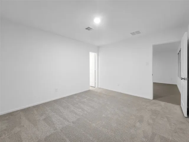a bathroom with a shower and a sink
