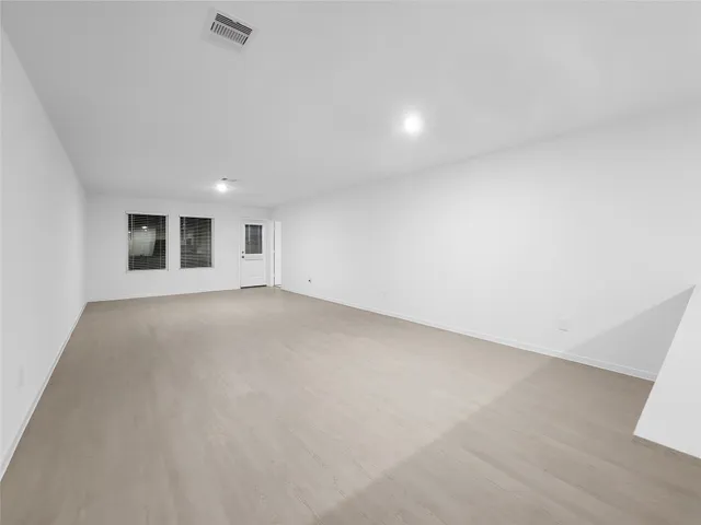 a view of an empty room and window
