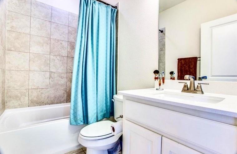 4215 Snow Goose Trail Arlington, TX 76005 - Photo 11 of 40 a bathroom with a sink a toilet and shower