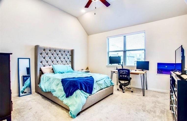 4215 Snow Goose Trail Arlington, TX 76005 - Photo 8 of 40 a bedroom with a bed and a chandelier