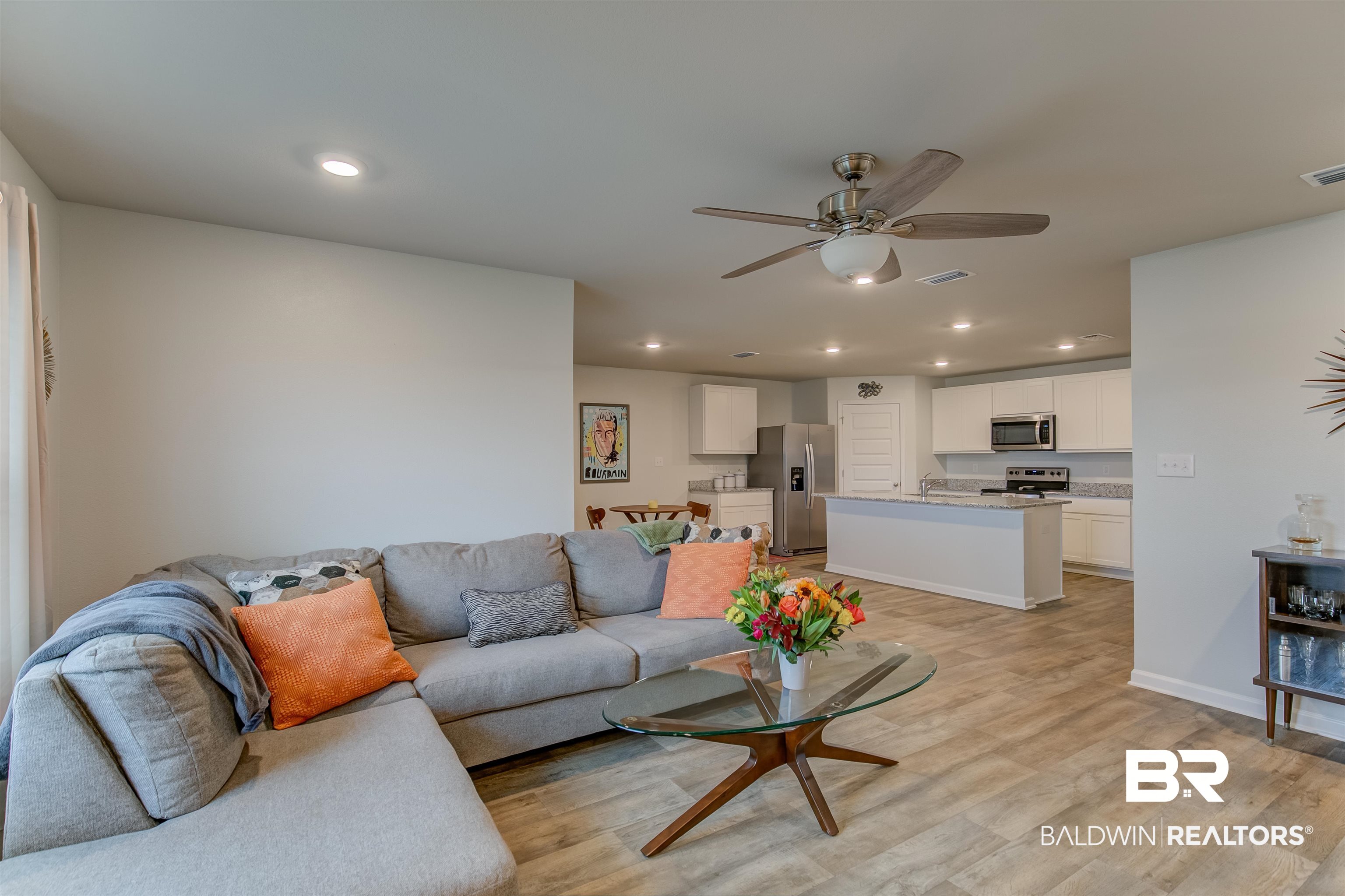 8033 Irwin Loop Daphne, AL 36526 - Photo 13 of 38 Expansive open-concept living area featuring wood-finish flooring, recessed lighting, and a ceiling fan