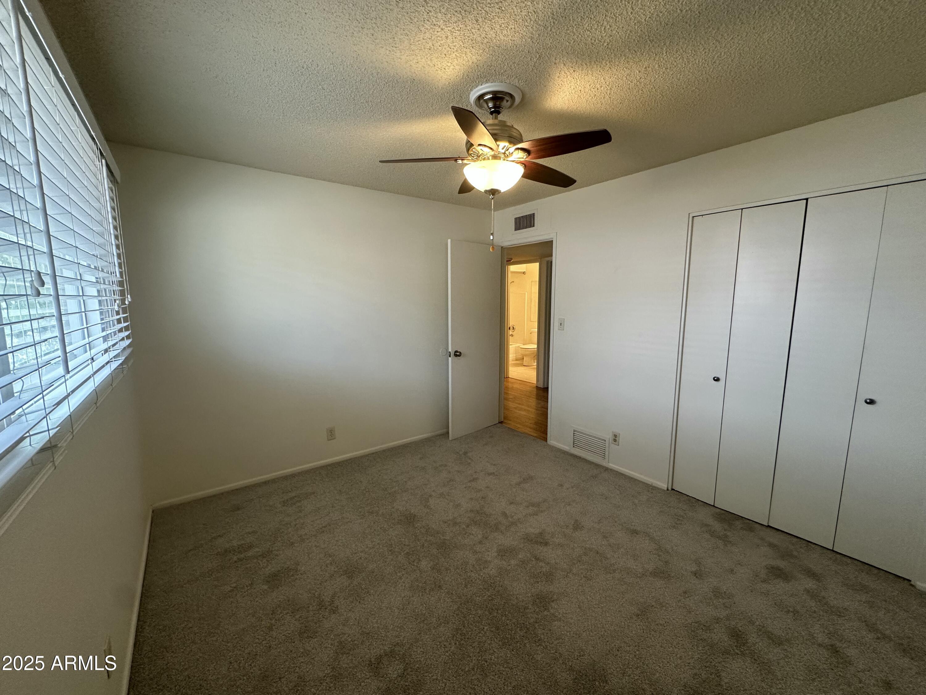 9414 North 17th Street Phoenix, AZ 85020 - Photo 12 of 19 a view of an empty room with a window