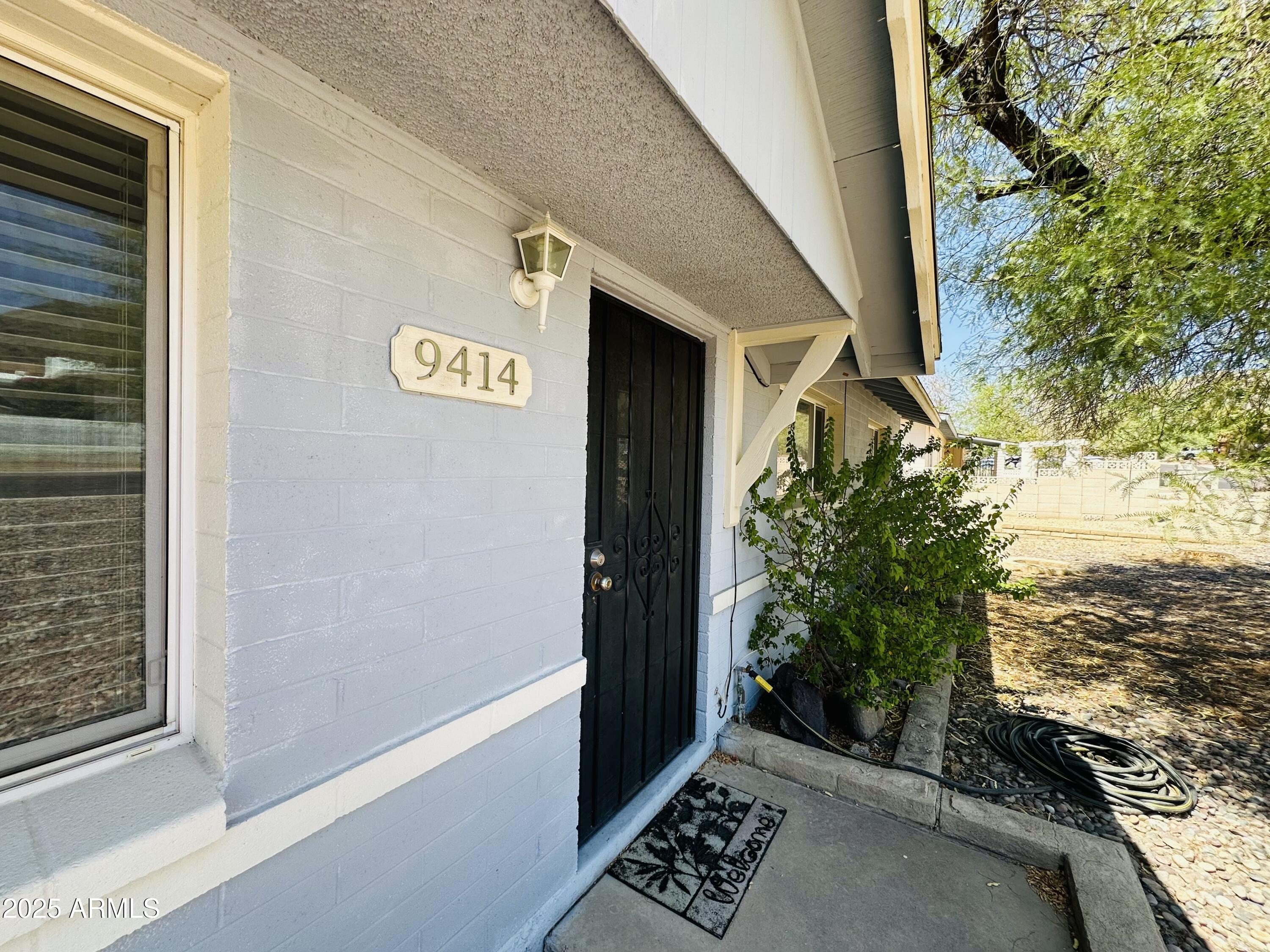 9414 North 17th Street Phoenix, AZ 85020 - Photo 18 of 19 a view of a door and wooden floor